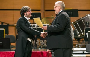 Alessandro Mazzamuto receiving the Award Diploma from Jury President Remy Franck